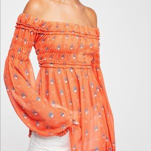 Looking for this top in white and orange!
